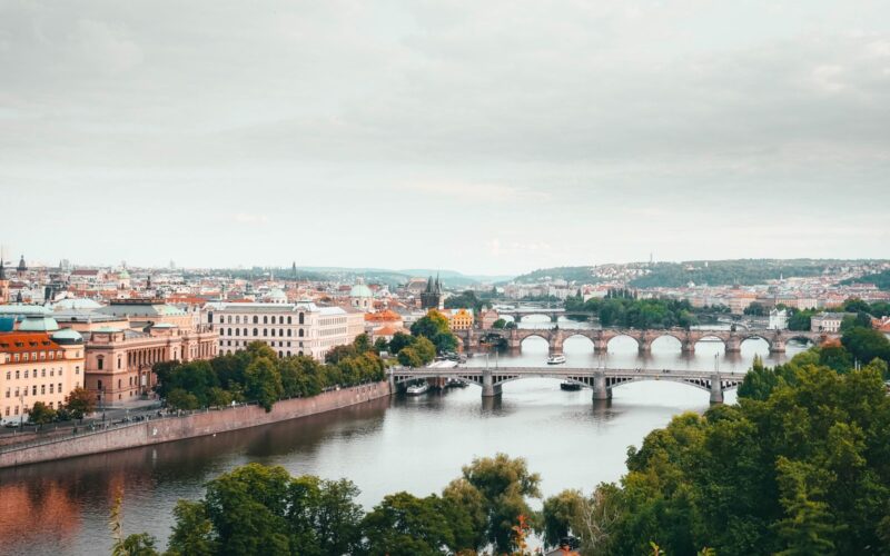 A stunning aerial view of Prague highlighting the city's bridges and historical architecture.