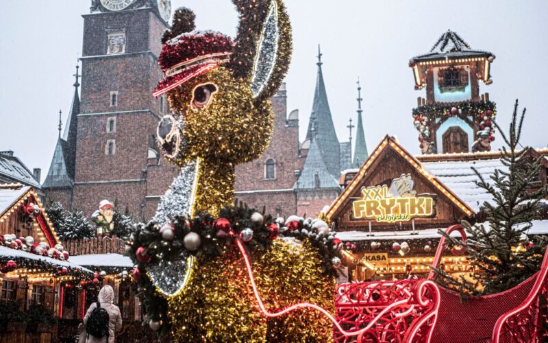 Snowy Christmas market scene with glittering reindeer. Festive and vibrant atmosphere.