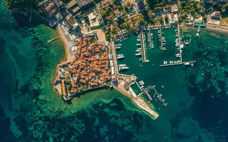 Stunning overhead view of Budva, Montenegro's historic coastal area and marina.